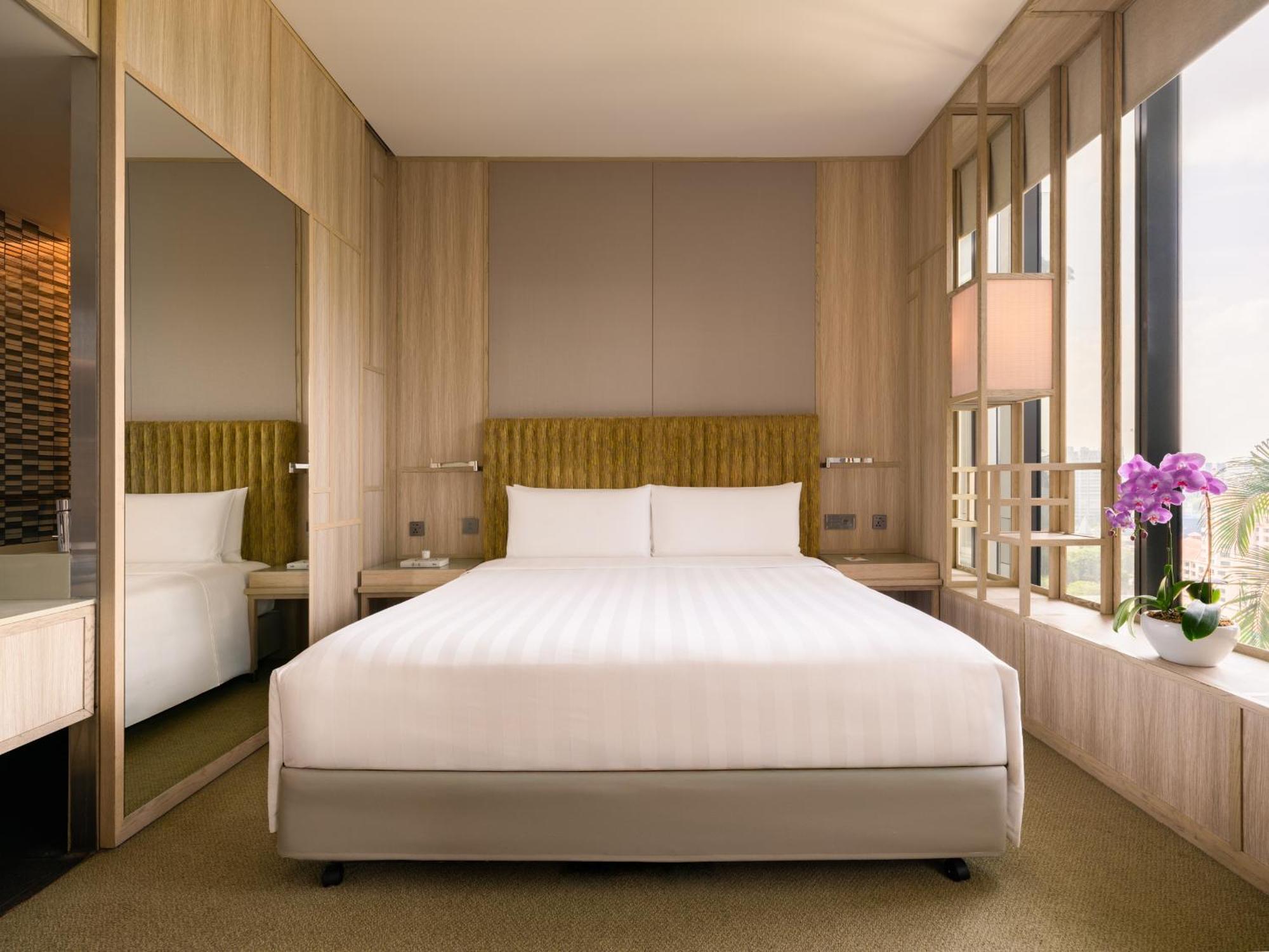 Parkroyal Collection Pickering, Singapura Luaran gambar A bedroom at the hotel